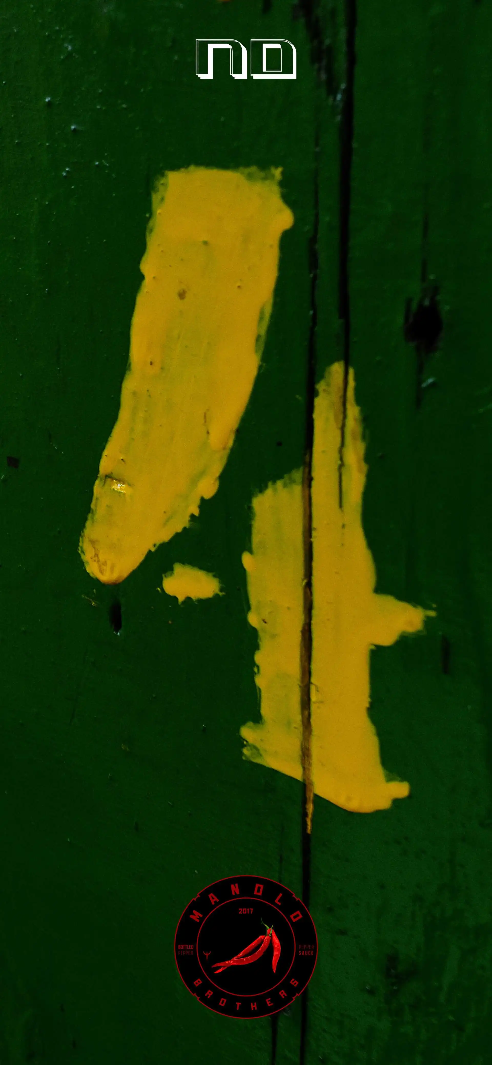 Banner de uma caixa de pimenta verde com 4 em amarelo, com logo da manolo brothers